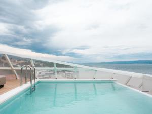 a swimming pool on the deck of a cruise ship at Boutique Hotel Venturo, a Member of Design Hotels in Split