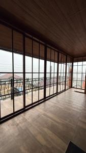 a large room with windows and a view of the ocean at Villa Lunka in Nuwara Eliya +16 photos