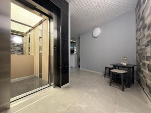 a hallway with a glass door and a table at Fresh Kiten in Kiten +60 photos