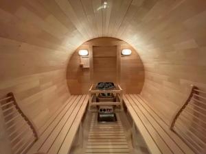 an inside view of a sauna with two chairs at 雪灯庵 in Iiyama
