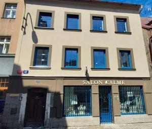 a building with a sallow salamine sign on it at Apartman Široká in Liberec