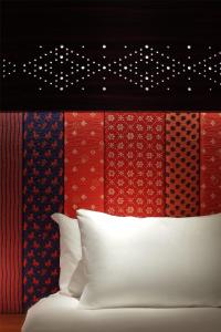 a wall with a bunch of different colored ties at Andaz Xintiandi, Shanghai, By Hyatt in Shanghai