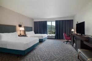 a hotel room with two beds and a television at Hampton Inn & Suites - Roanoke-Downtown, VA in Roanoke +49 photos