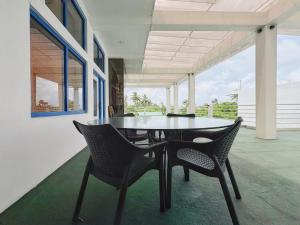 a dining room with a table and chairs at Phoenix house ahangama in Ahangama