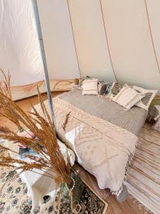 a bedroom with a bed in a tent at Lahemaa Nature Glamping - Eha in Vihasoo
