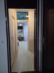 a hallway with a view of a room at Garsonjera - centar Igalo in Igalo