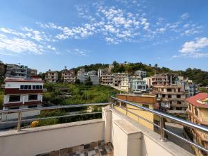 a view of a city from a balcony at Nirva Chey in Kathmandu