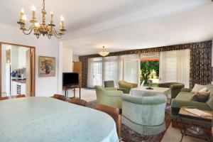 a living room with a table and chairs and a dining room at Ferienhaus Leni in Edertal