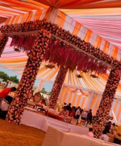 a group of people sitting at a table in a tent at Hotel Waterlily in Indore