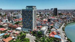 an overhead view of a city with a tall building at Wink Hai Phong Centre, Unscripted by Hyatt - 24 Hours stay in Hai Phong
