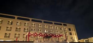 a building with red flags in front of it at Hotel Waterlily in Indore