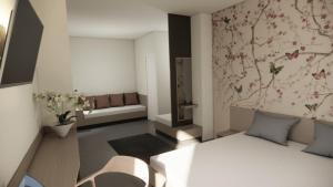 a room with a couch and a chair in a room at Adua Rooms - Tropea Center in Tropea +18 photos