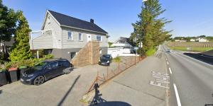 a car parked in the driveway of a house at Local home apartment in Stavanger in Stavanger