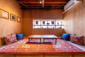 a small room with a table on a rug at 波と月 in Oarai +70 photos