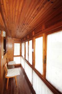 a room with a table and some windows at La Llosa II in Villaviciosa