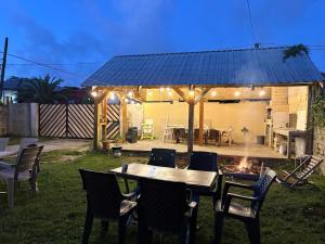 a table and chairs under a gazebo at EmiLiza in Kobuleti