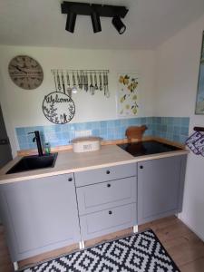 a kitchen with a counter top and a sink at Moordiele in Kröpelin