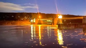 a bridge over a body of water at night at Gästehaus Bonaforth in Hannoversch Münden