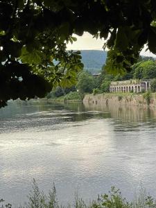 a view of a river with a castle in the distance at Gästehaus Bonaforth in Hannoversch Münden +18 photos