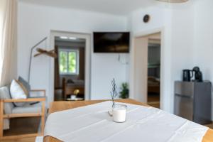 a table with a white table cloth on it at Apartment Camping Melk in Melk