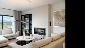 a living room with a couch and a table at The One in Port d'Andratx