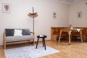 a living room with a couch and a table at Apartment Camping Melk in Melk