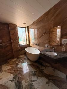 a bathroom with two sinks and a large tub at Israel Ori Hotel in Yerevan +38 photos