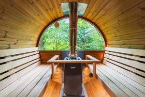 an inside view of a sauna with a window at GOZDNE VILE va VRTI in Kostel +60 photos