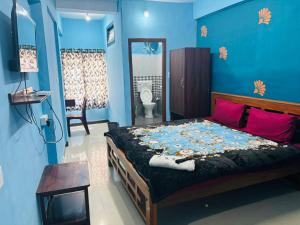 a bedroom with a bed with flowers on it at SB Cottage ooty in Ooty