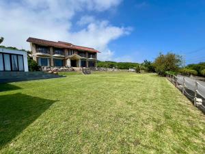 a large yard in front of a house at Garden BBQ and Stay ANCHOR in Miyakojima