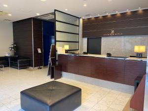 a lobby of a hotel with a reception desk at Green Rich Hotel Hiroshima Shinkansenguchi (Artificial hot spring Futamata Yunohana) in Hiroshima