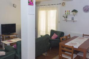 Televízia a/alebo spoločenská miestnosť v ubytovaní Gospodar Apartments