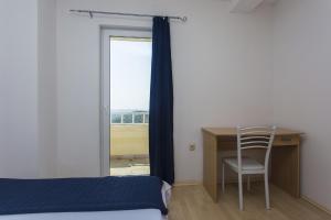 Posteľ alebo postele v izbe v ubytovaní Gospodar Apartments