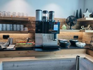 a coffee maker sitting on top of a counter at Berghotel Arthurhaus in Mühlbach am Hochkönig