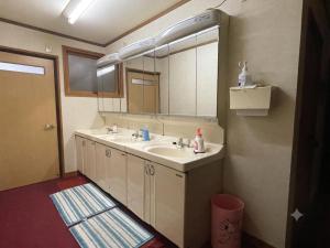 a bathroom with a sink and a mirror at Mizubaso in Gujo +27 photos