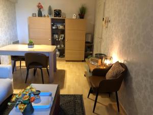 a living room with a couch and a table at les terrasses2 in Ostend +25 photos