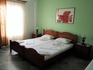 Posteľ alebo postele v izbe v ubytovaní Grivas Apartments
