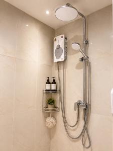 a shower with a shower head in a bathroom at Salisa Resort in Ko Lipe +91 photos