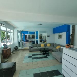 a living room with a couch and a table at Renos Apartments in Polis Chrysochous