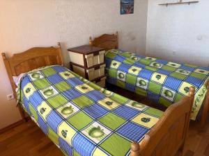 two beds sitting next to each other in a room at Marsel Odesa in Odesa