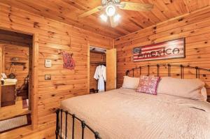 a bedroom with a bed in a log cabin at Pet-Friendly Mountain Heaven - Hot Tub and Fire Pit in Blue Ridge +24 photos