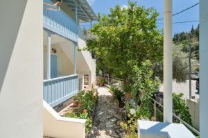 a view of a house with a garden at Villa Milia 2 in Agios Nikitas +15 photos