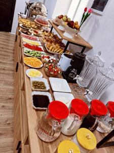 a buffet line with many different types of food at Archa Hotel Kochkor in Kochkorka