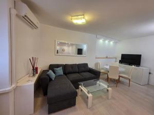 a living room with a couch and a table at Breece Hideaway in Piran