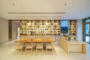 a dining room with a table and some chairs at JI Hotel Beijing Changyang Subway Station in Fangshan
