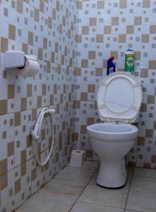 a bathroom with a toilet and a shower at Bamburi BnB in Mombasa +47 photos