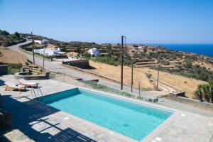 a swimming pool with a view of the ocean at Taeri Sifnos in Sifnos +92 photos