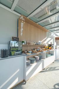 a bakery counter with plates of food on display at Villa Sarmassa in Narzole
