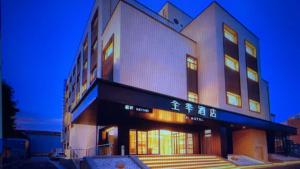 a building with an asian writing on the side of it at JI Hotel Beijing Huilongguan in Changping