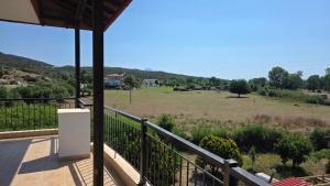 a view of a field from the balcony of a house at Anemos House Sykia Halkidiki in Sykia Chalkidikis